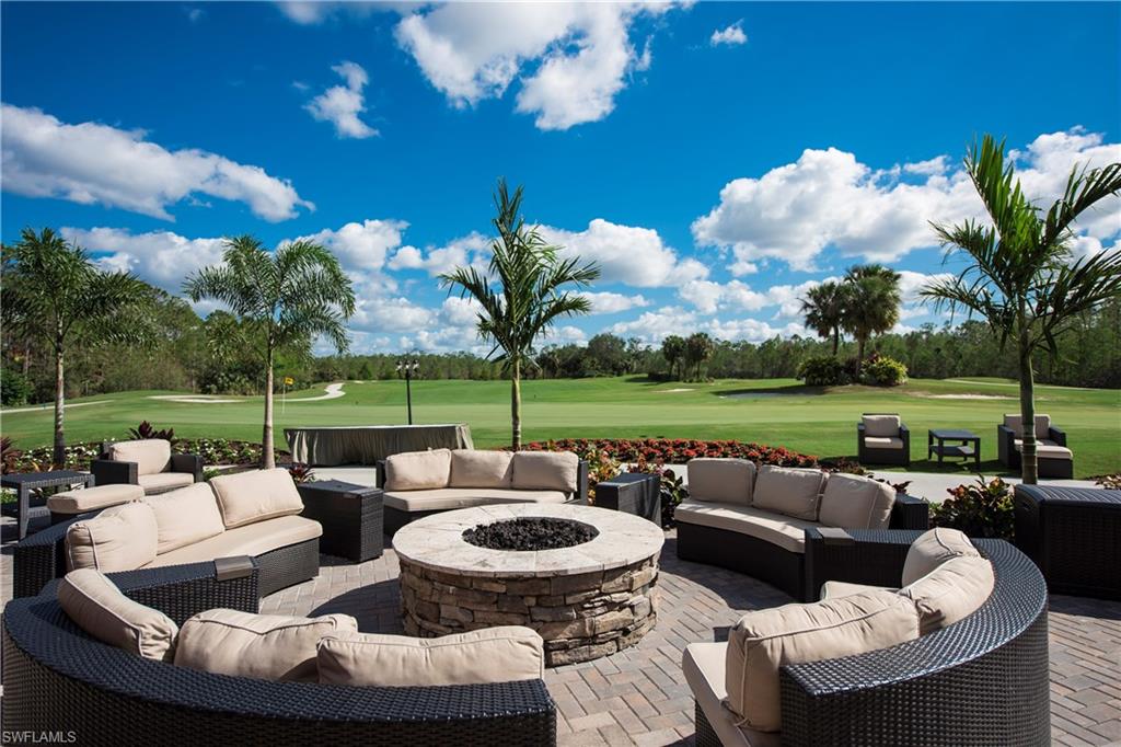 7635 Arbor Lake Court, Unit 2423 Naples, FL 34112 - Photo 27 of 35 a view of a patio with couches potted plants and a big swimming pool