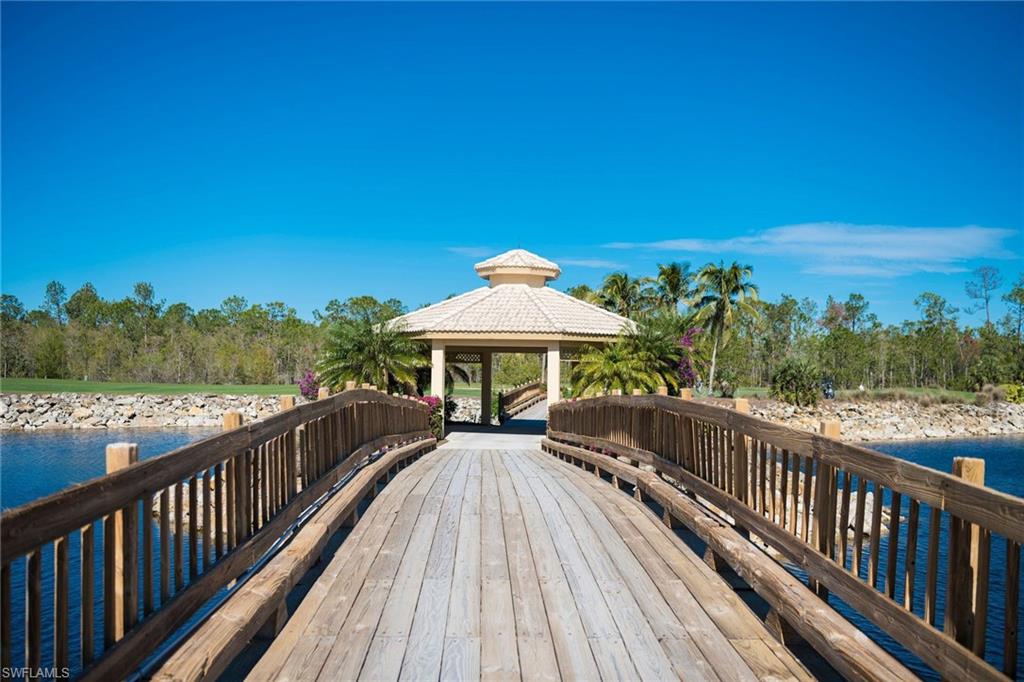 7635 Arbor Lake Court, Unit 2423 Naples, FL 34112 - Photo 29 of 35 a view of a wooden deck with a garden