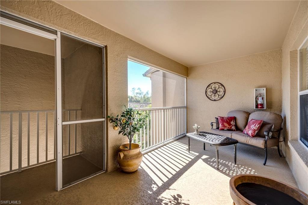 7635 Arbor Lake Court, Unit 2423 Naples, FL 34112 - Photo 3 of 35 a living room with furniture and a potted plant