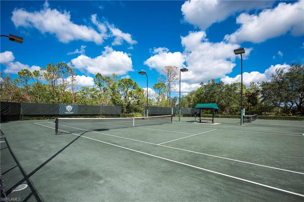 7635 Arbor Lake Court, Unit 2423 Naples, FL 34112 - Photo 34 of 35 a view of a tennis court