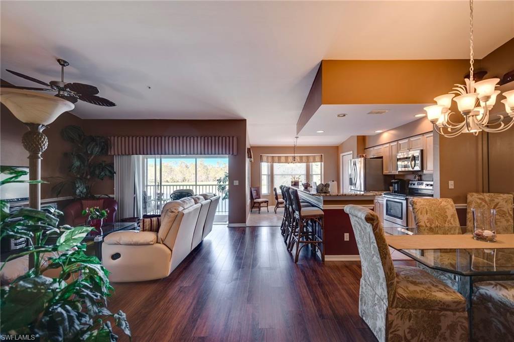 7635 Arbor Lake Court, Unit 2423 Naples, FL 34112 - Photo 5 of 35 a view of a dining room with furniture window and outside view