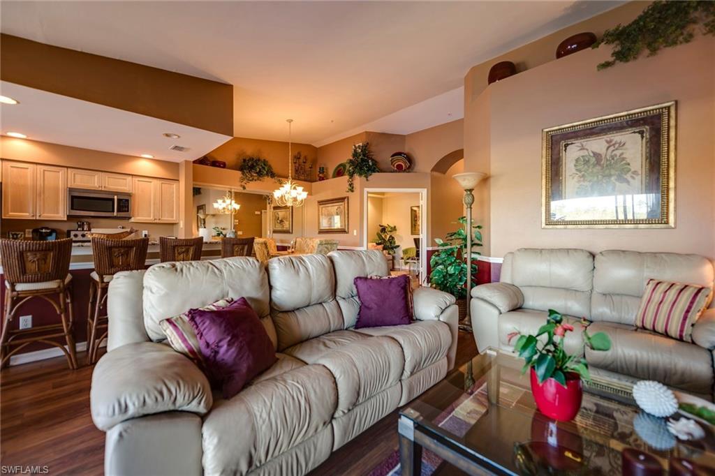 7635 Arbor Lake Court, Unit 2423 Naples, FL 34112 - Photo 9 of 35 a living room with furniture kitchen and a window