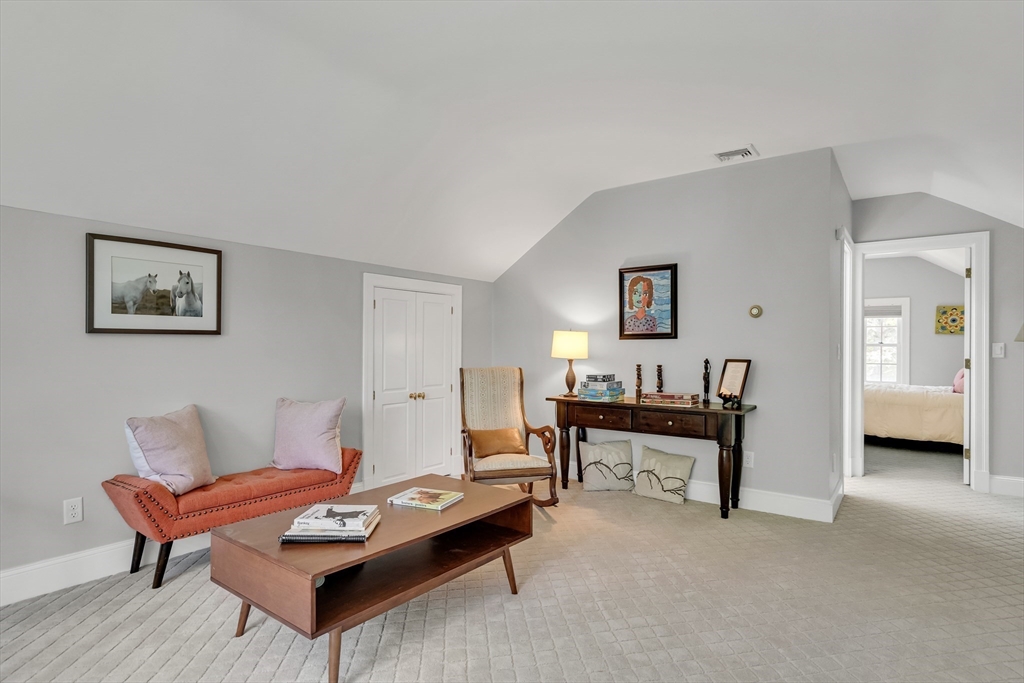 34 Solomon Pierce Road Lexington, MA 02420 - Photo 27 of 42 a living room with furniture and a wooden floor