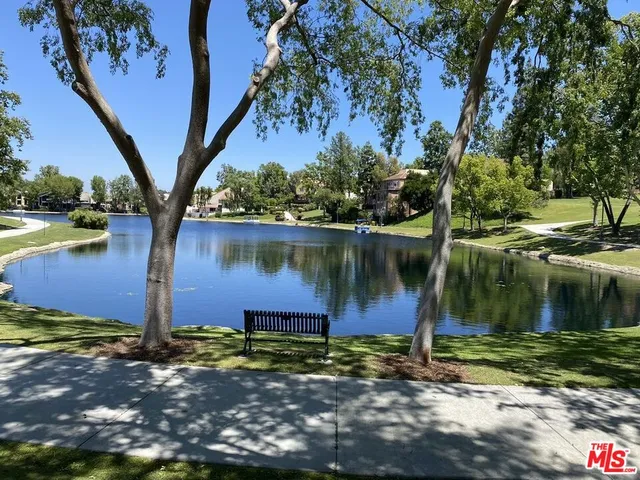 a view of a lake with a building in the background