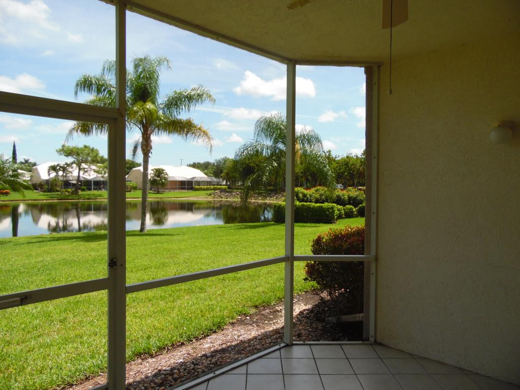 9009 Michael Circle, Unit 109 Naples, FL 34113 - Photo 11 of 18 a view of a garden from a window
