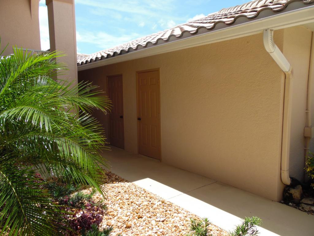 9009 Michael Circle, Unit 109 Naples, FL 34113 - Photo 15 of 18 a view of a backyard