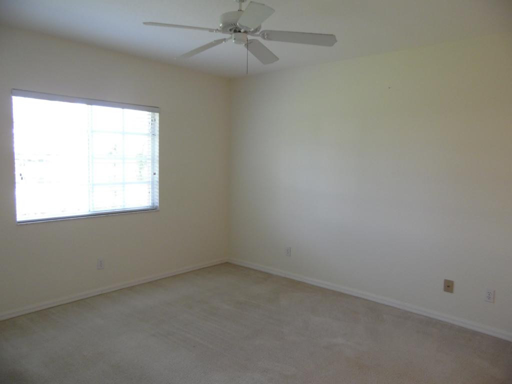 9009 Michael Circle, Unit 109 Naples, FL 34113 - Photo 7 of 18 an empty room with a window