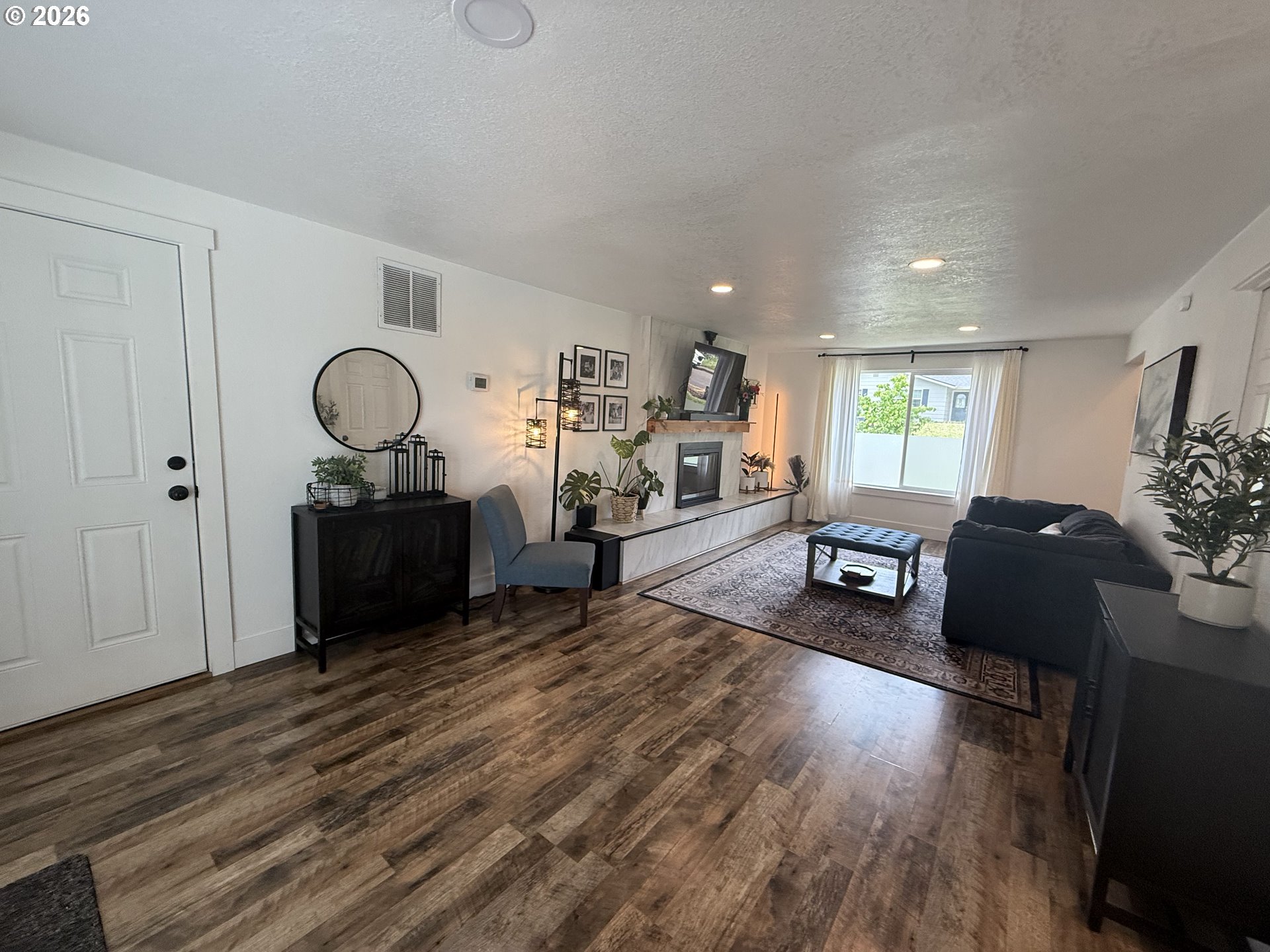 6974 Glacier Drive Springfield, OR 97478 - Photo 3 of 37 a living room with furniture and wooden floor