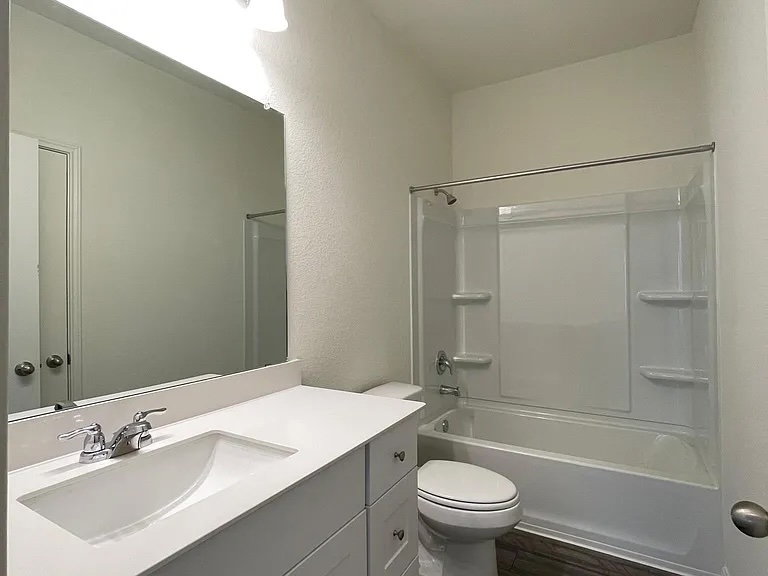 627 Alterra Way Maxwell, TX 78656 - Photo 7 of 10 a bathroom with a sink a toilet and shower
