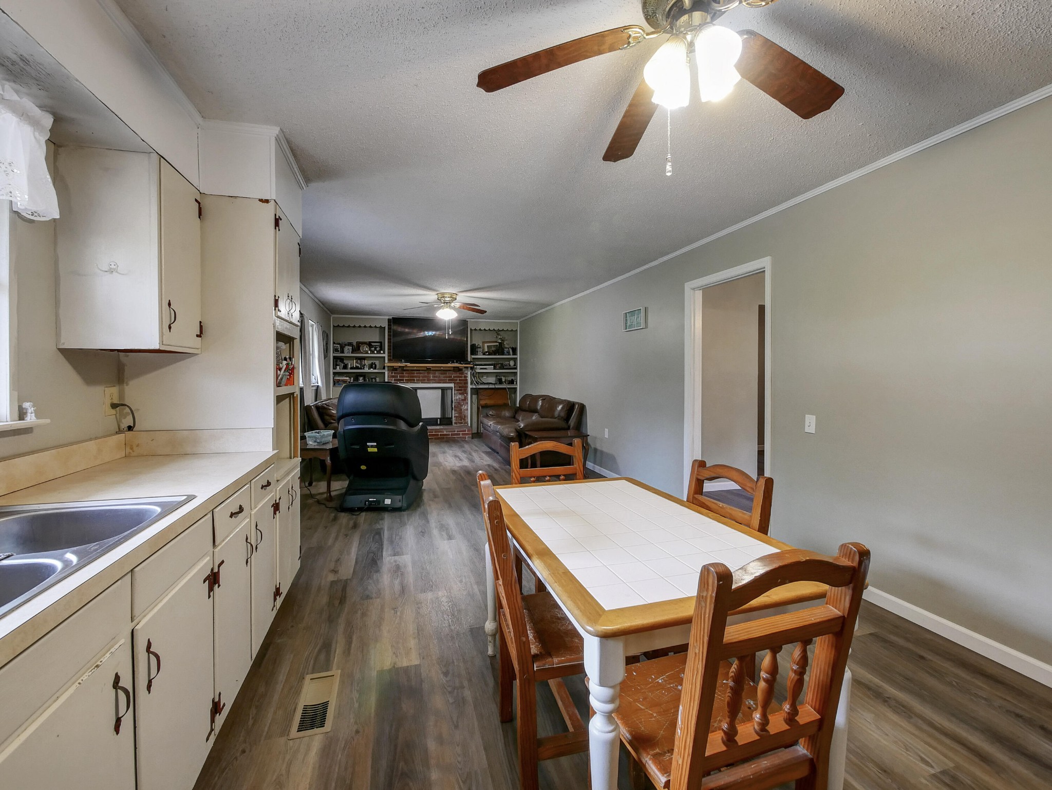 902 Lindsay Avenue Chattanooga, TN 37421 - Photo 14 of 29 a kitchen that has a table chairs and a refrigerator