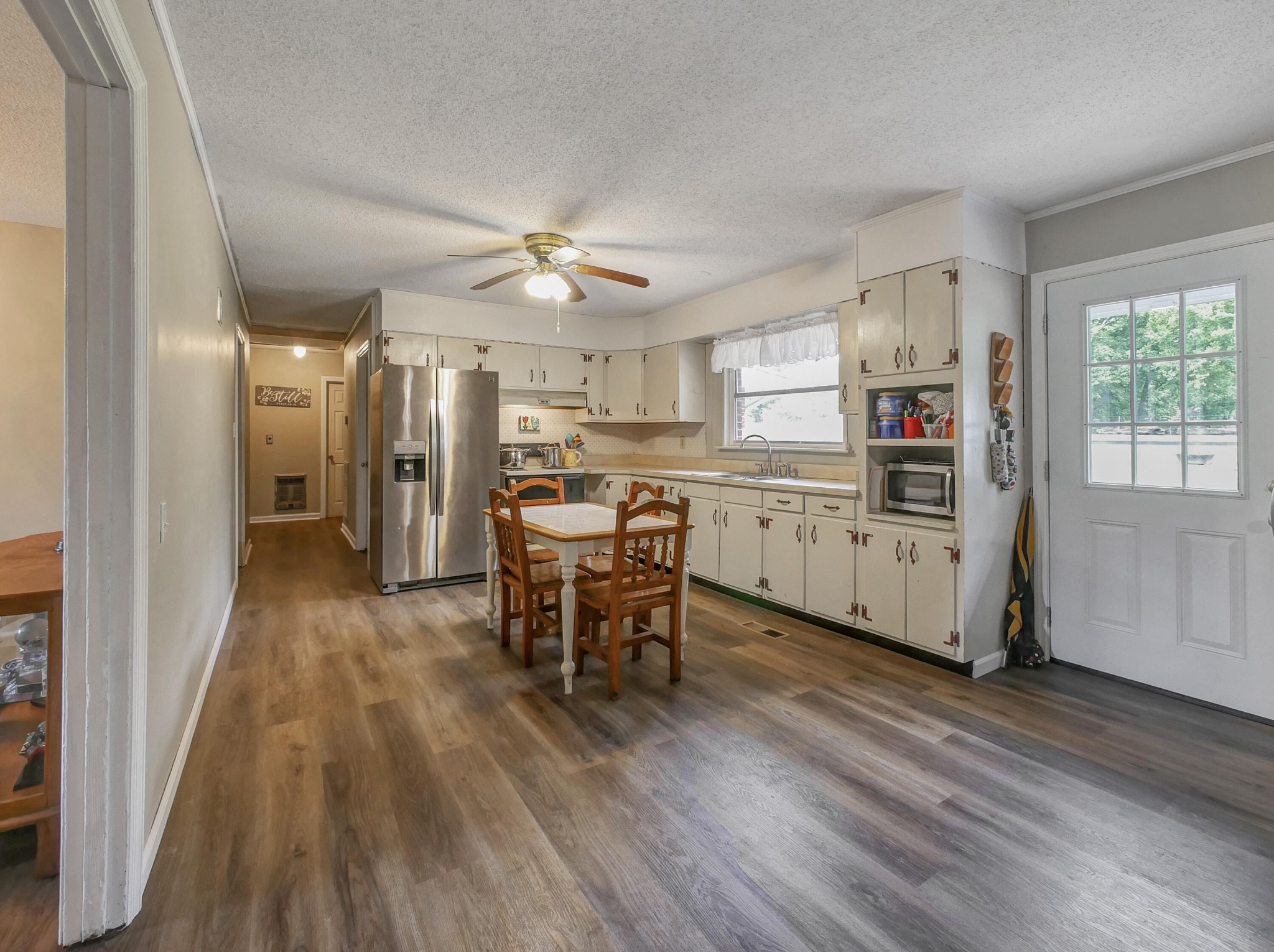 902 Lindsay Avenue Chattanooga, TN 37421 - Photo 16 of 29 a kitchen with stainless steel appliances a dining table chairs and wooden floor