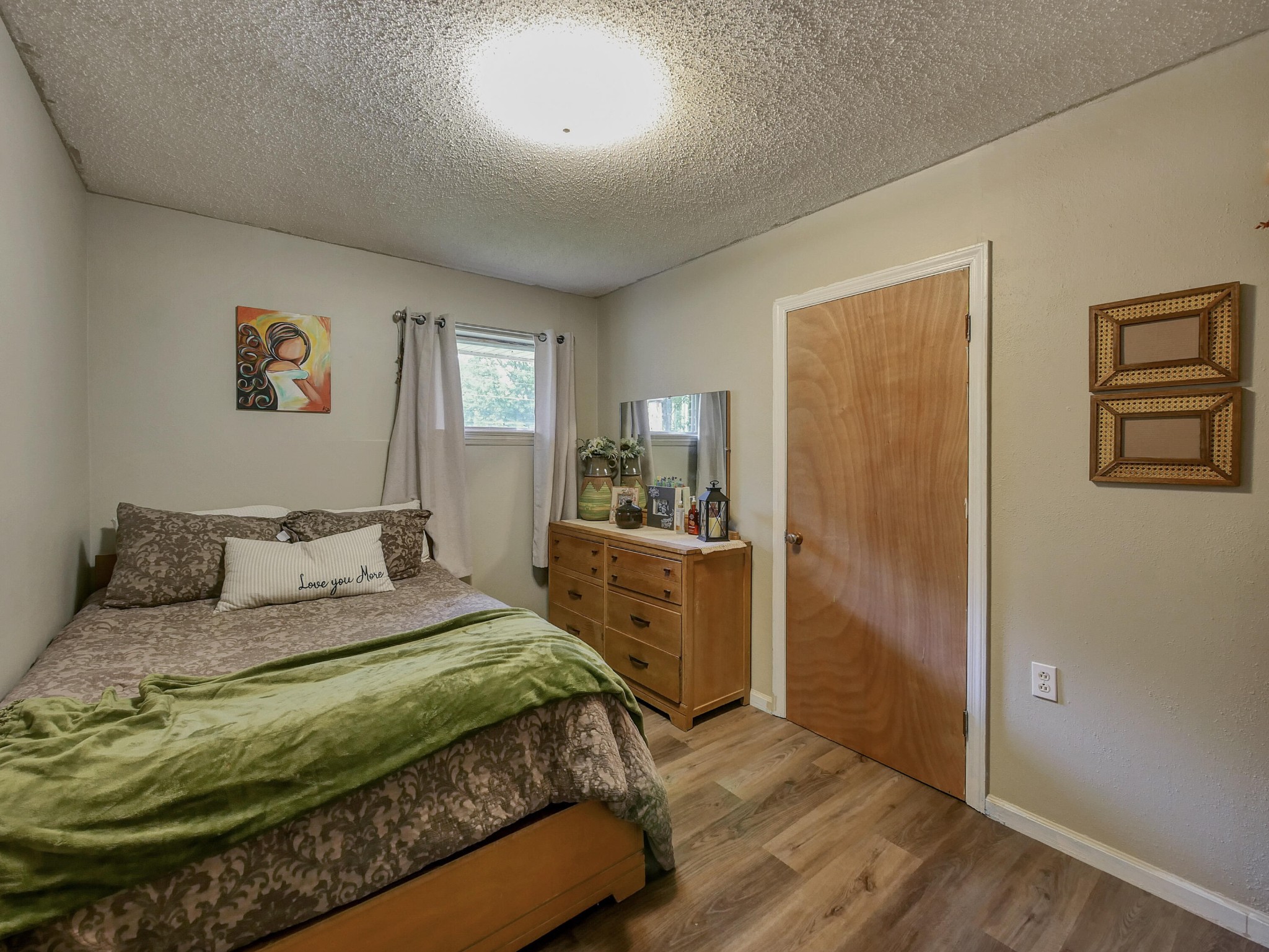 902 Lindsay Avenue Chattanooga, TN 37421 - Photo 17 of 29 a bedroom with a bed and a dresser