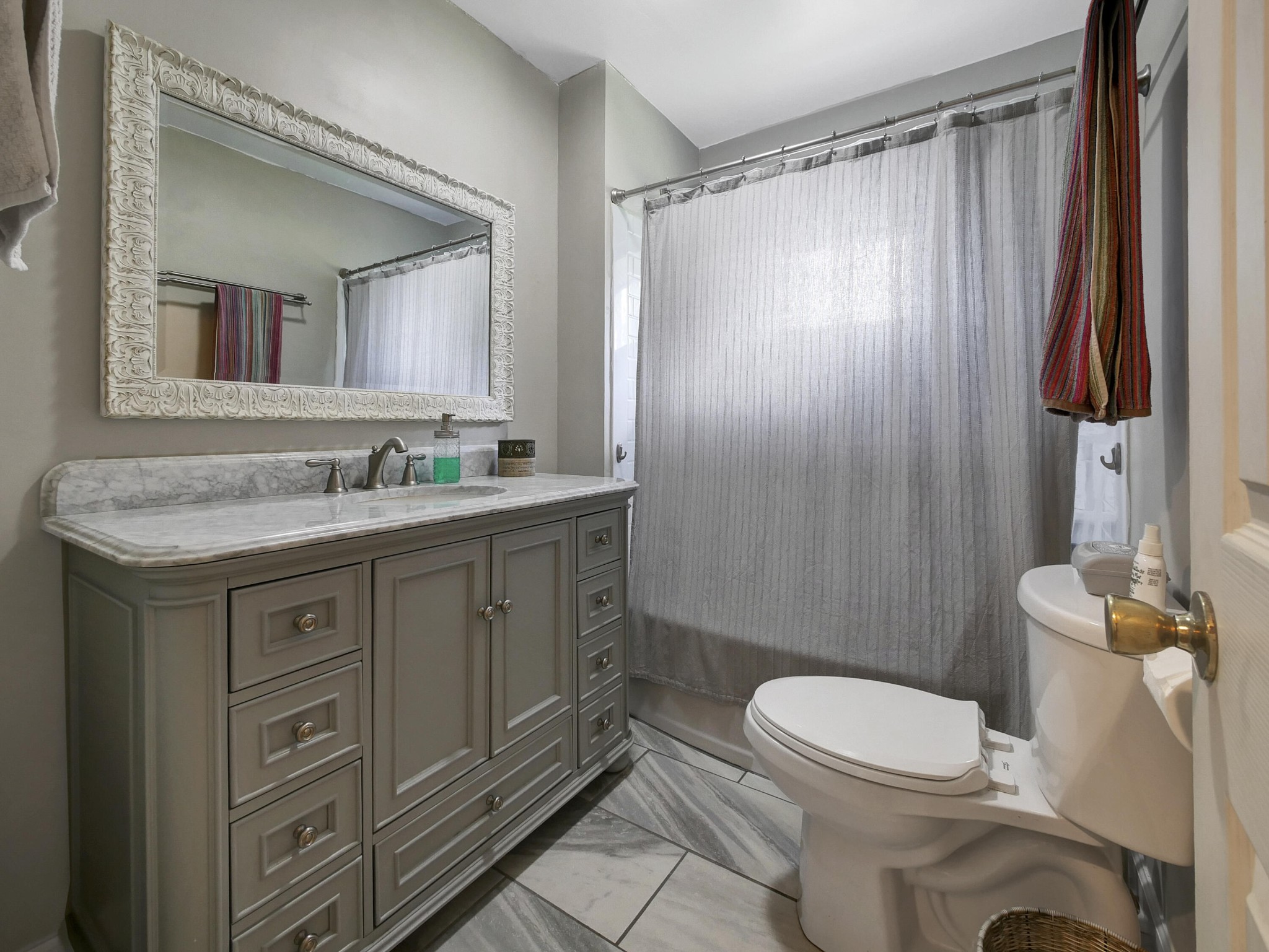 902 Lindsay Avenue Chattanooga, TN 37421 - Photo 19 of 29 a bathroom with a granite countertop sink toilet and shower