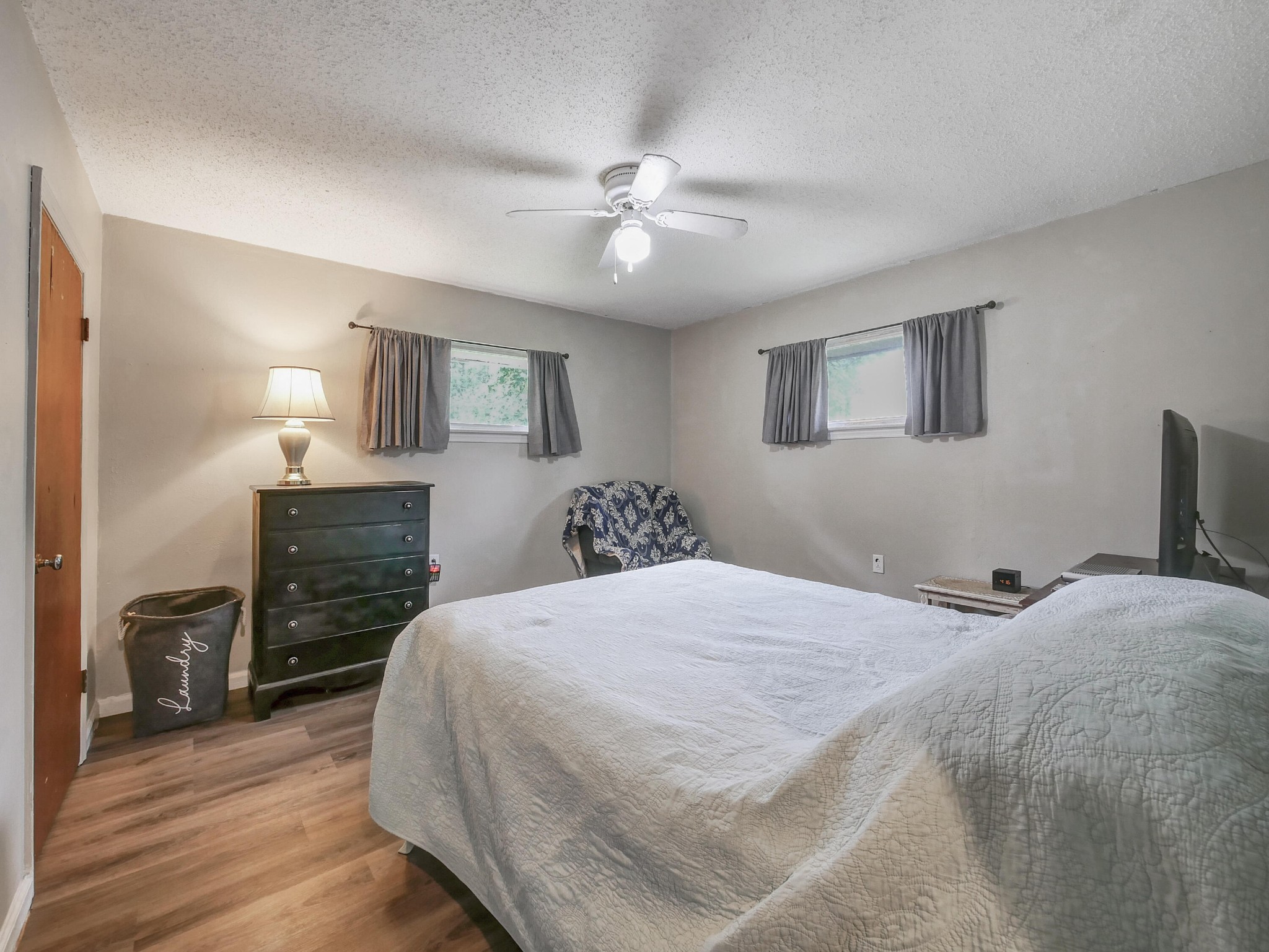 902 Lindsay Avenue Chattanooga, TN 37421 - Photo 20 of 29 a bedroom with a bed and a flat tv screen on dresser