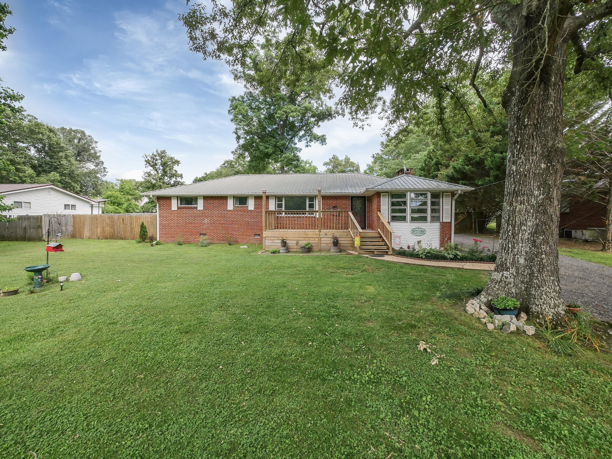 902 Lindsay Avenue Chattanooga, TN 37421 - Photo 2 of 29 a view of a house with a yard balcony and sitting area