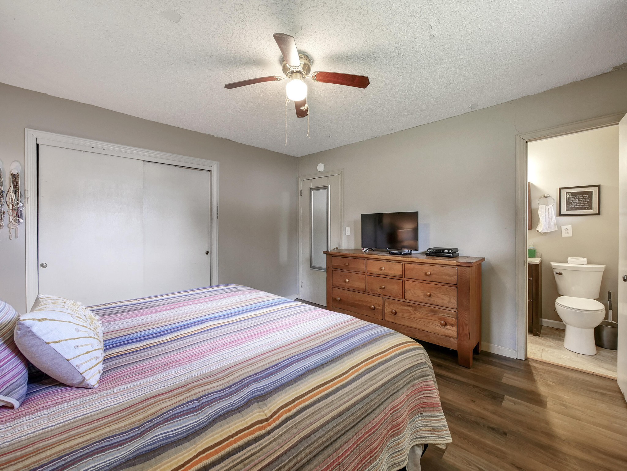 902 Lindsay Avenue Chattanooga, TN 37421 - Photo 22 of 29 a bedroom with a bed and a chandelier