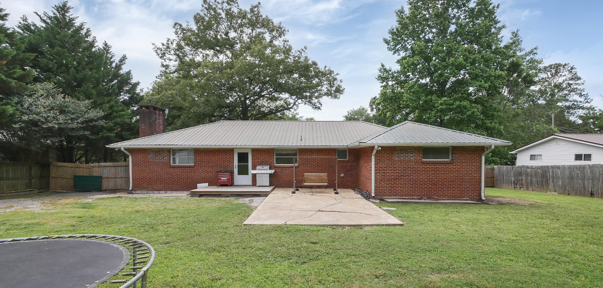 902 Lindsay Avenue Chattanooga, TN 37421 - Photo 27 of 29 a front view of a house with a yard fire pit and outdoor seating