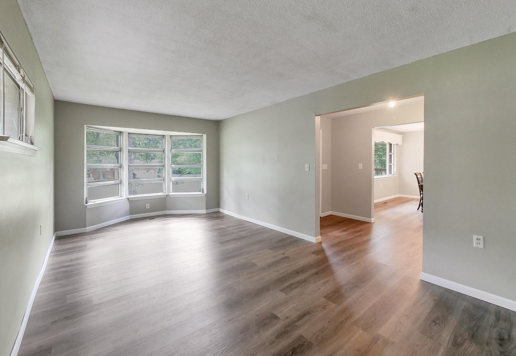 902 Lindsay Avenue Chattanooga, TN 37421 - Photo 8 of 29 wooden floor in an empty room with a window