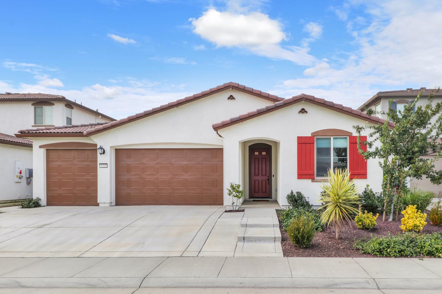 5321 Fandango Loop Roseville, CA 95747 - Photo 1 of 38 a front view of a house with potted plants