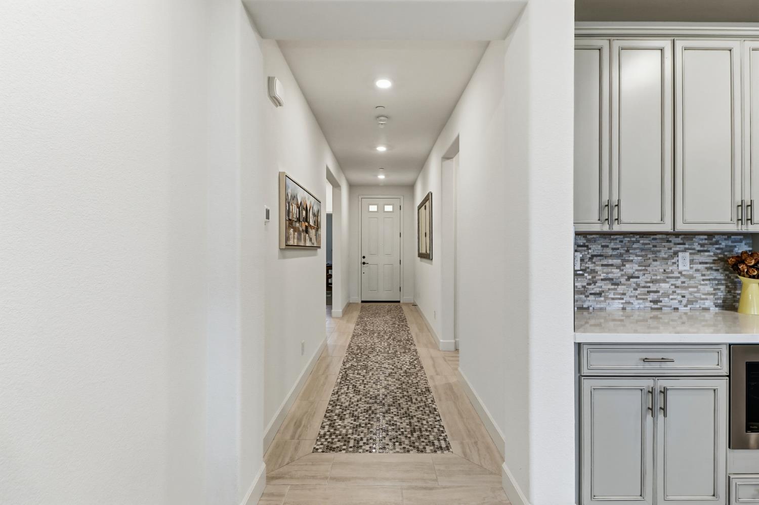 5321 Fandango Loop Roseville, CA 95747 - Photo 19 of 38 a view of a hallway with wooden floor and staircase