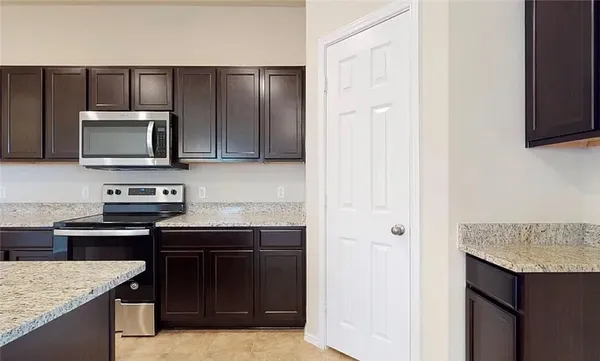 a kitchen with a sink and a microwave
