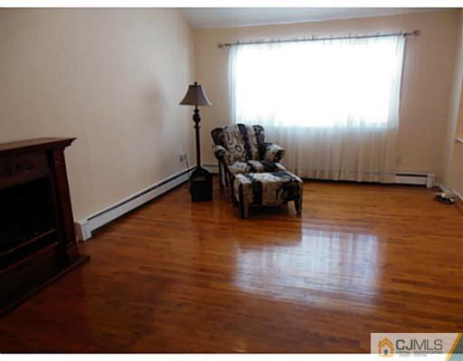 43 Poplar Road Piscataway, NJ 08854 - Photo 11 of 21 a view of livingroom with furniture hardwood floor and workspace