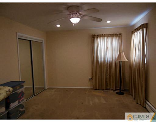 43 Poplar Road Piscataway, NJ 08854 - Photo 16 of 21 an empty room with windows and closet