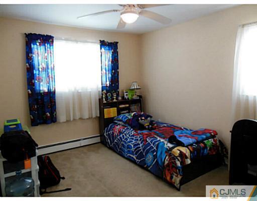 43 Poplar Road Piscataway, NJ 08854 - Photo 19 of 21 a bedroom with a bed and a window