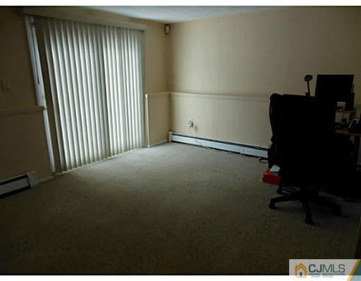 43 Poplar Road Piscataway, NJ 08854 - Photo 20 of 21 a view of a workspace with furniture and a window
