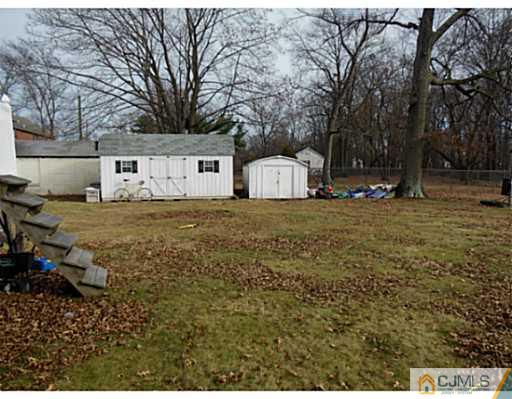 43 Poplar Road Piscataway, NJ 08854 - Photo 4 of 21 a view of a yard with large trees