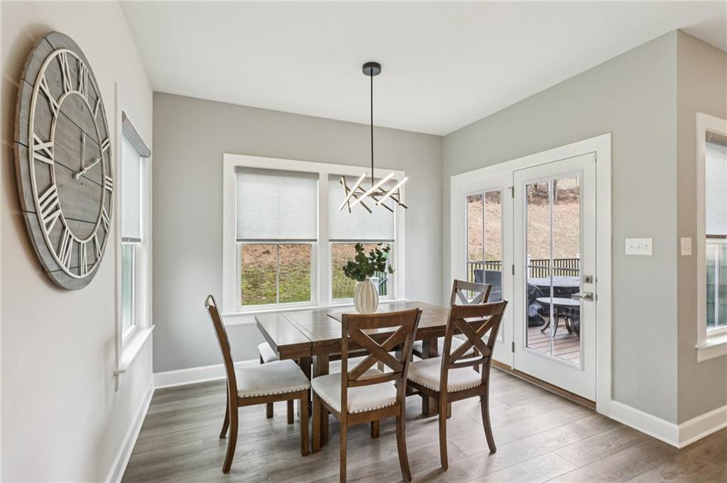 320 Crest Lane Mars, PA 16046 - Photo 11 of 37 a view of a dining room with furniture window and wooden floor