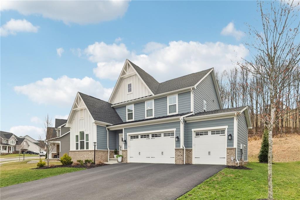 320 Crest Lane Mars, PA 16046 - Photo 2 of 37 a view of a white house next to a yard with big trees