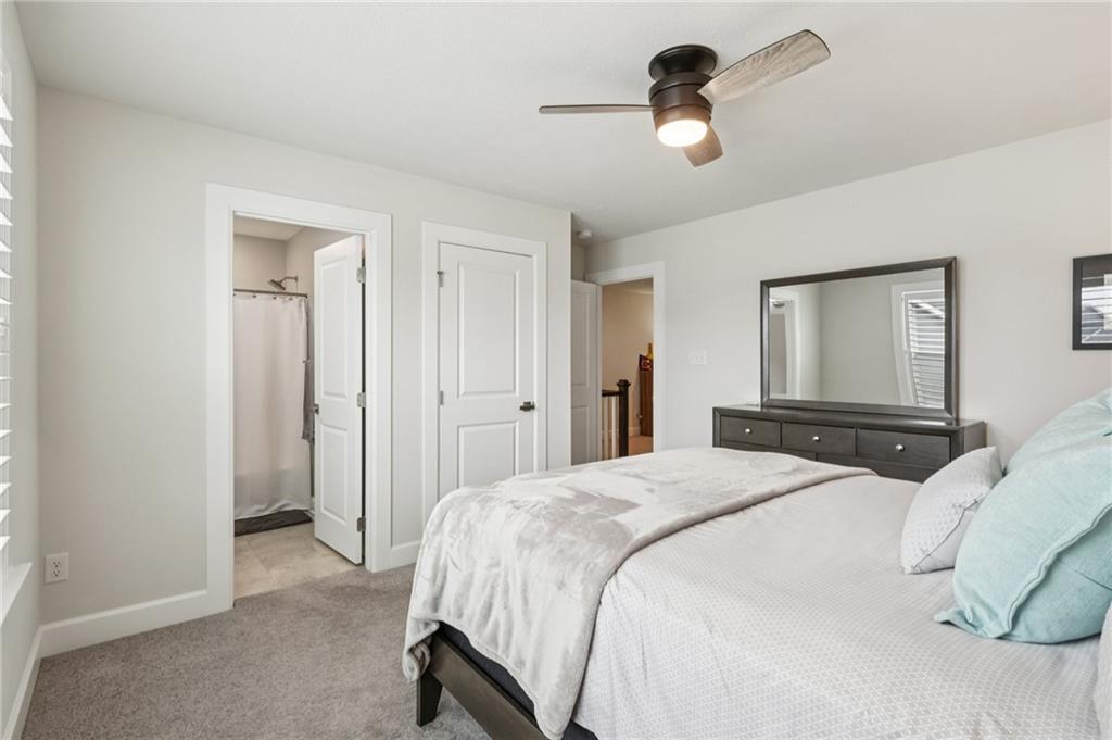 320 Crest Lane Mars, PA 16046 - Photo 22 of 37 a bedroom with a bed and a chandelier