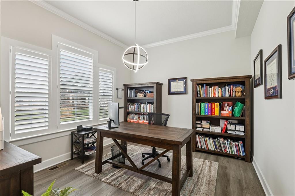 320 Crest Lane Mars, PA 16046 - Photo 4 of 37 a view of a workspace with furniture and a bookshelf