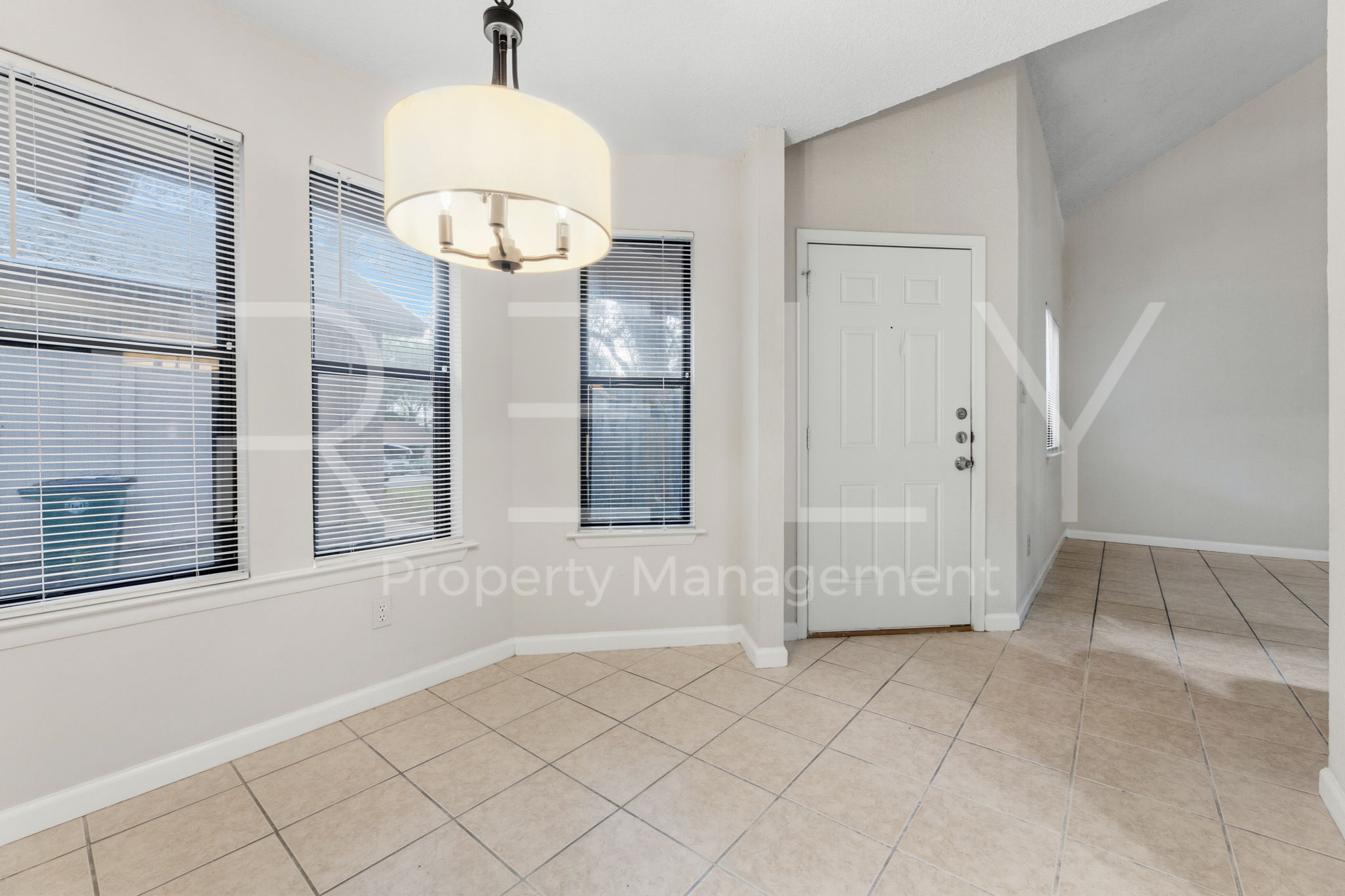 1005 Milford Way, Unit A Austin, TX 78745 - Photo 12 of 30 an empty room with windows