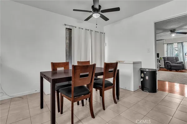 a kitchen with stainless steel appliances white cabinets and a window
