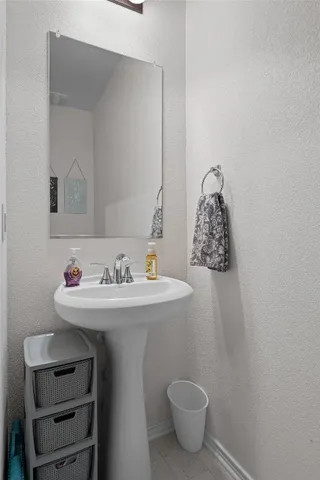 a bathroom with a sink and a toilet