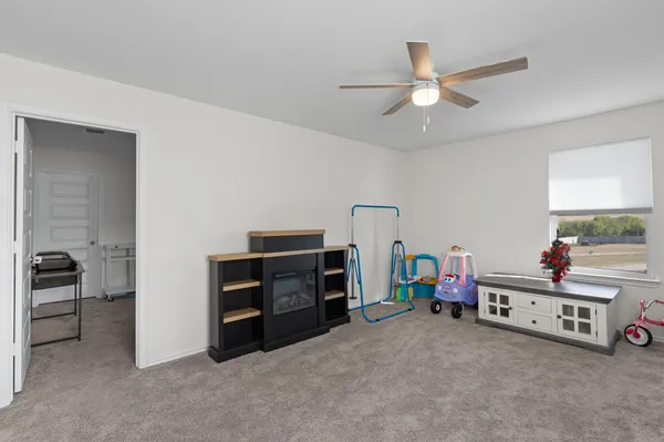 a kids room with chair and closet