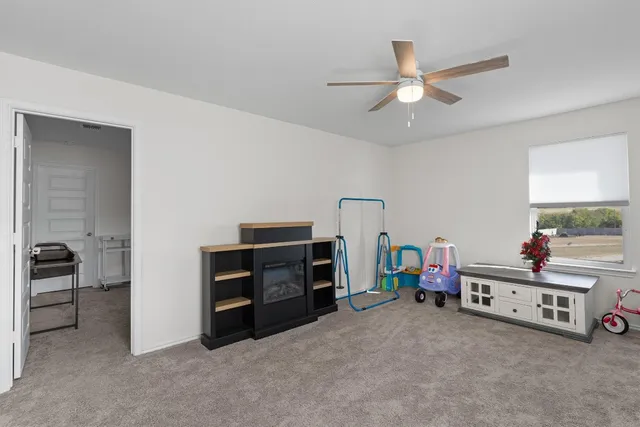 a kids room with chair and closet