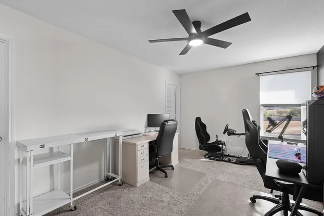 a view of a workspace with furniture