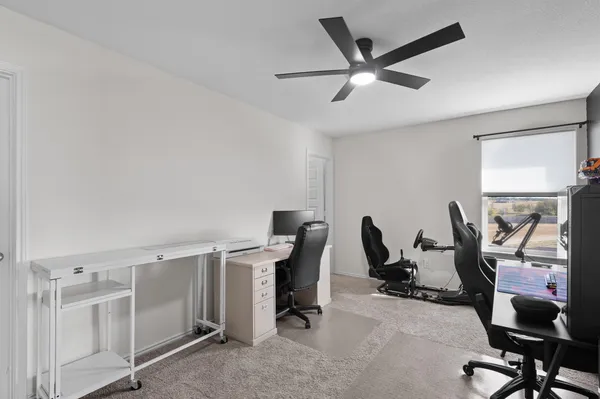 a view of a workspace with furniture