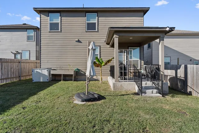 a swimming pool with some trees in the background