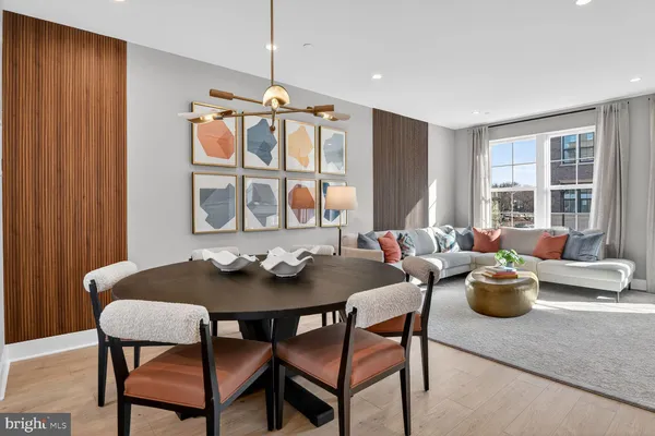 a kitchen with center island table and chairs