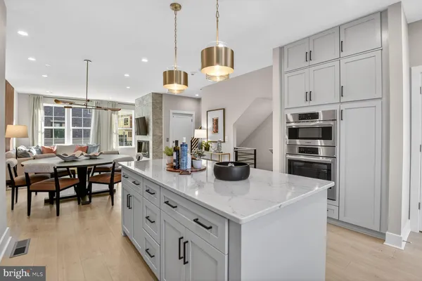 a kitchen with cabinets a sink and appliances