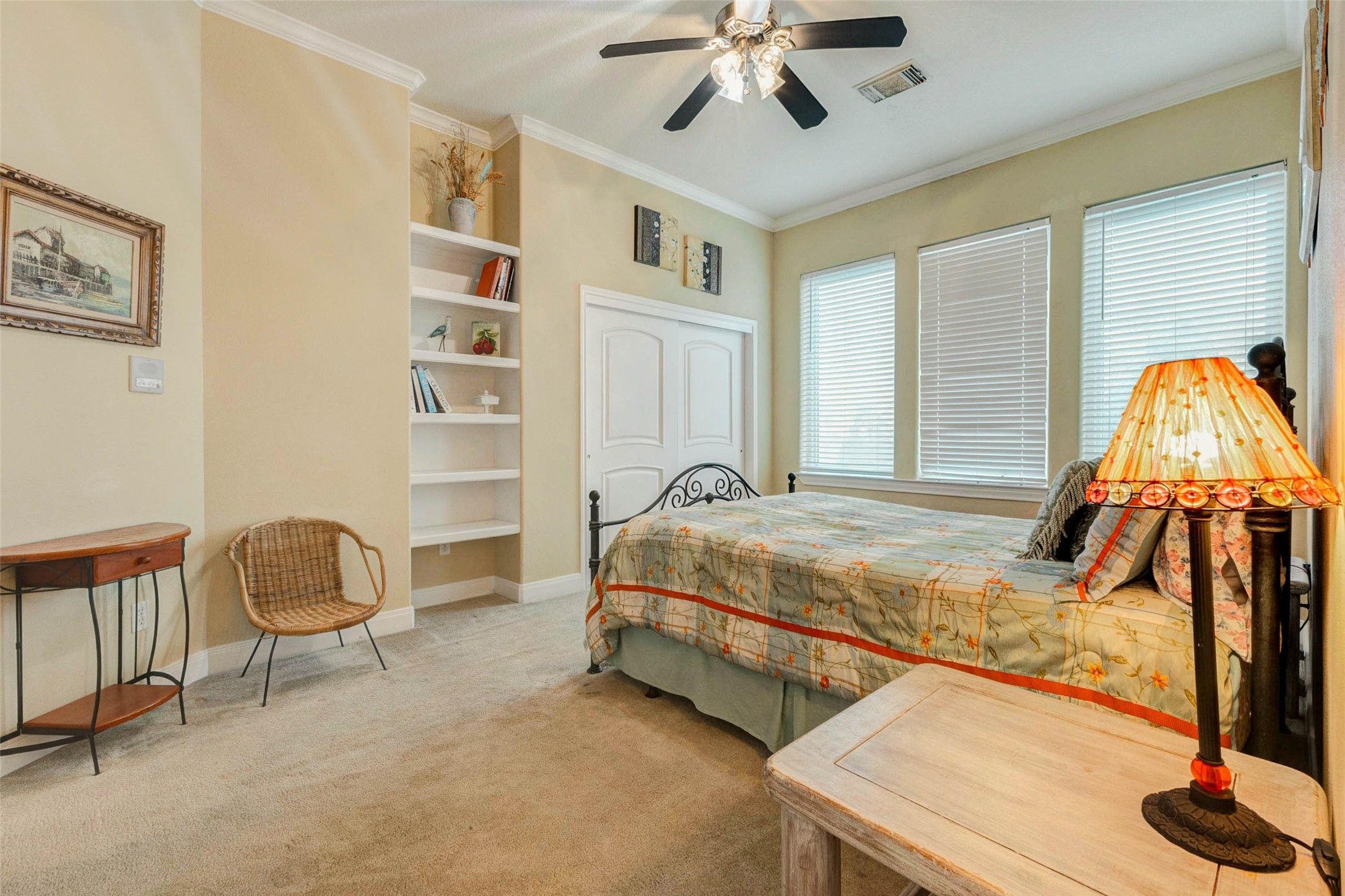 2732 Broadway Street Dickinson, TX 77539 - Photo 25 of 50 a bedroom with a bed and a chandelier