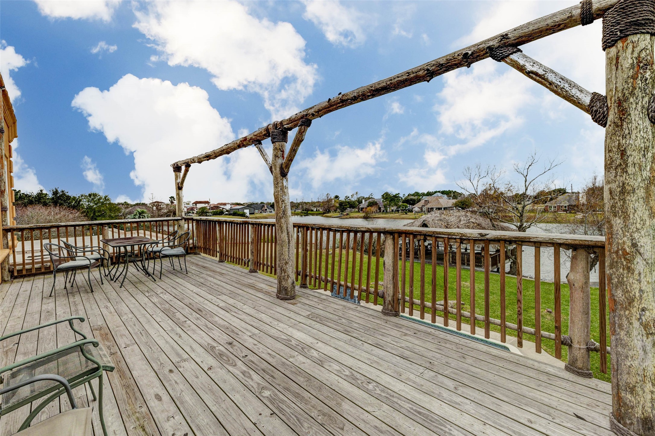 2732 Broadway Street Dickinson, TX 77539 - Photo 42 of 50 a view of balcony with wooden floor & fence