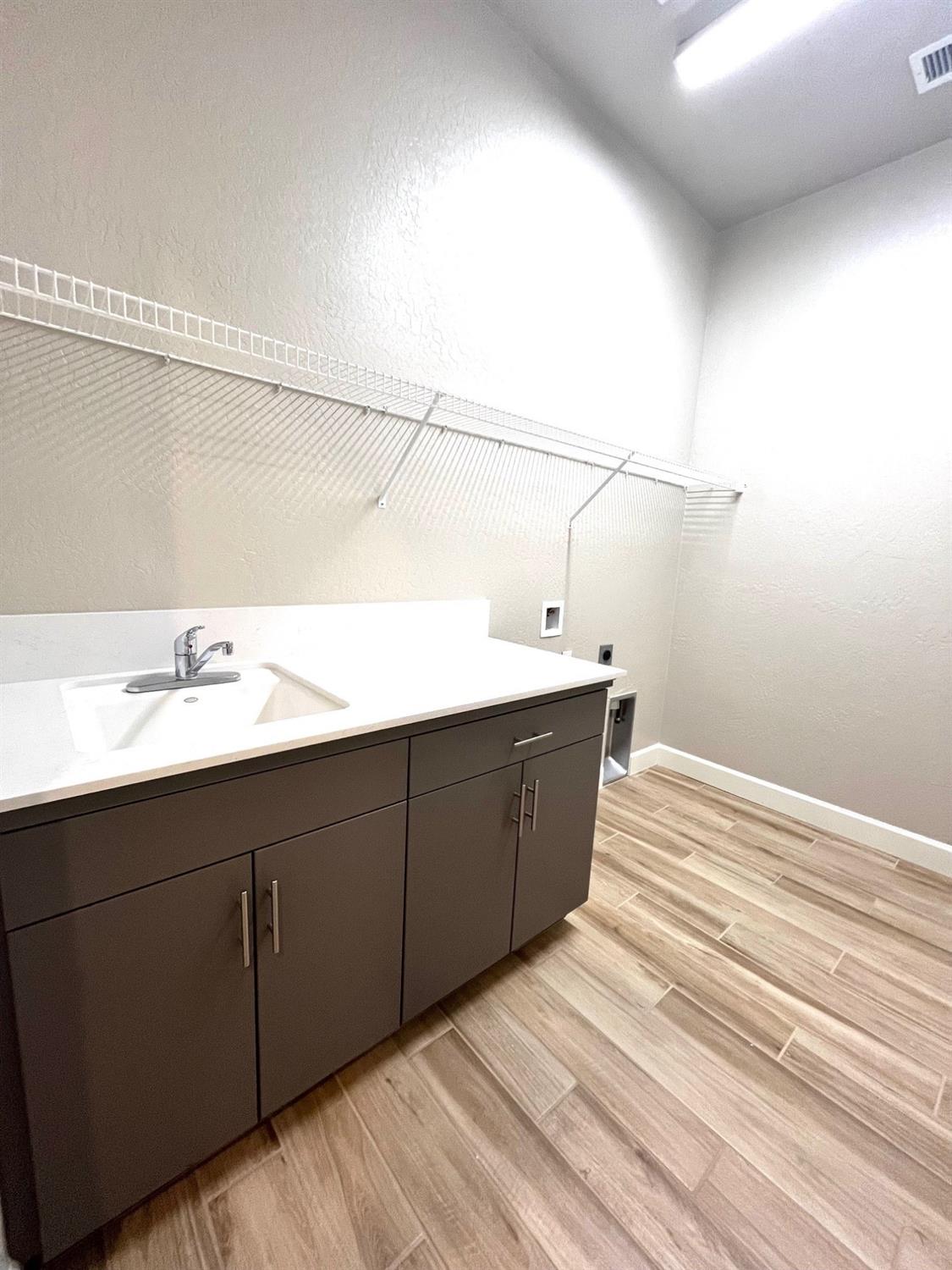 682 Bloom Lane Clovis, CA 93619 - Photo 21 of 30 a bathroom with a sink and mirror