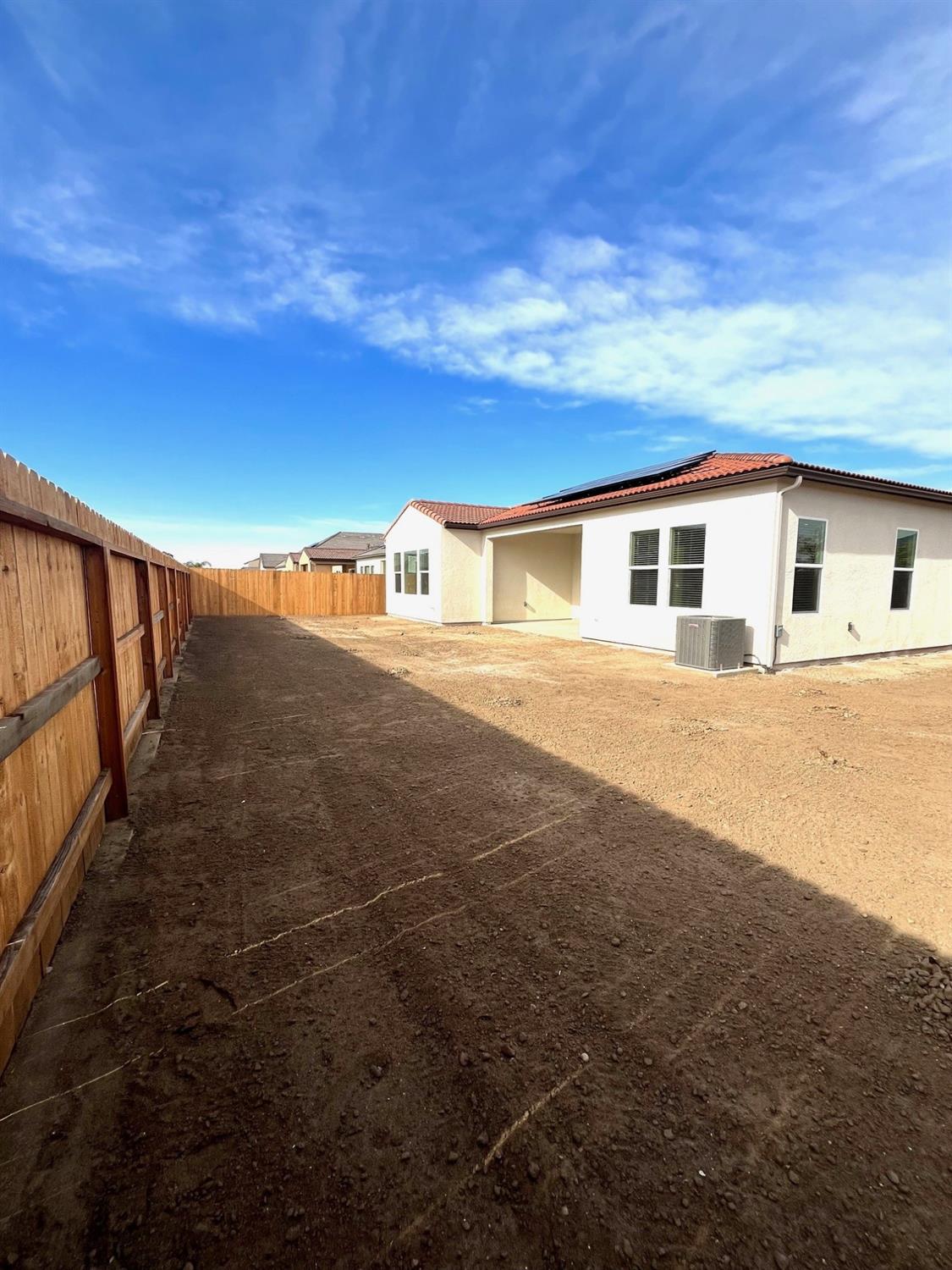 682 Bloom Lane Clovis, CA 93619 - Photo 25 of 30 a view of a house with a yard