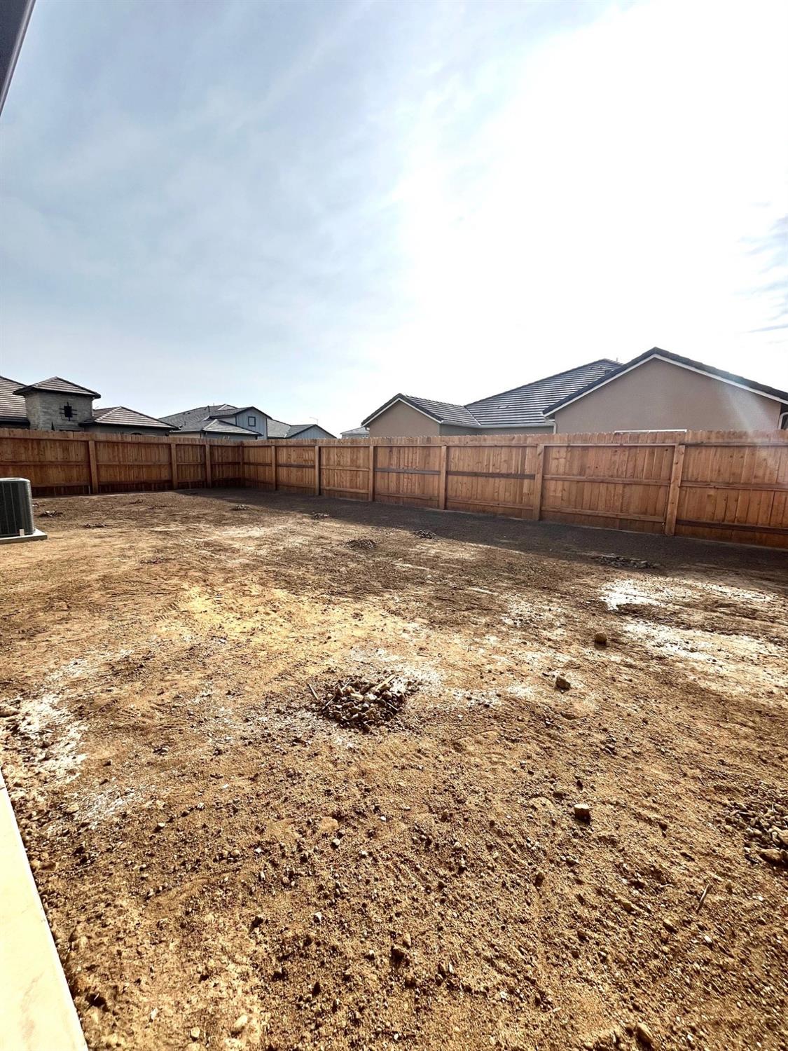 682 Bloom Lane Clovis, CA 93619 - Photo 27 of 30 a view of a backyard of the house