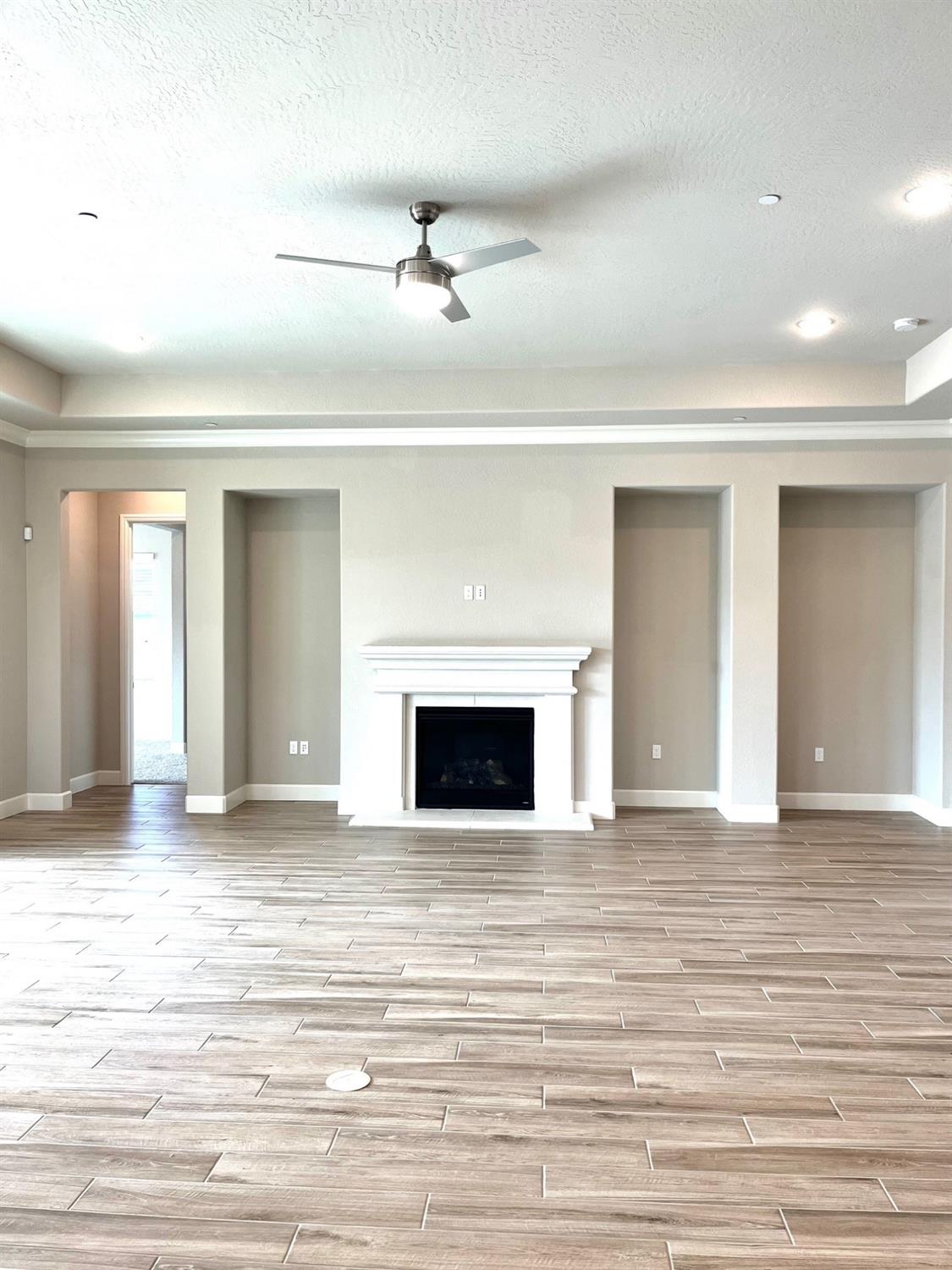 682 Bloom Lane Clovis, CA 93619 - Photo 3 of 30 a view of a livingroom with a fireplace